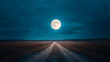 © Phasathon - A serene nighttime landscape featuring a bright full moon illuminating a lonely dirt road under a dark, cloudy sky.