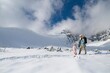 © Halfpoint - Mom and small girl walking through beautiful snowy nature. Family enjoying winter holiday in the mountains, playing in snow.