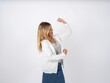 © Roquillo - Profile photo of excited Beautiful teen girl wearing white jacket good mood raise fists screaming rejoicing overjoyed basketball sports fan supporter