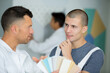 © auremar - decorator discussing colour samples with apprentice