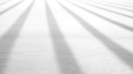 Poster - Soft shadows extending gracefully across a textured white surface in bright light during the day