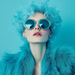 © sunaiart - A fashion photograph of an eccentric woman with voluminous hair, wearing blue sunglasses and a teal fur coat, posing in front of a turquoise background.