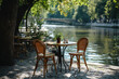 Summer outdoor cafe. Empty table in a cafe on the embankment in French style.