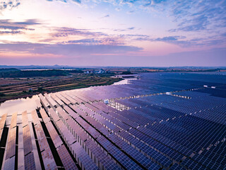 Wall Mural - Solar photovoltaic panels array aerial photography at sunset