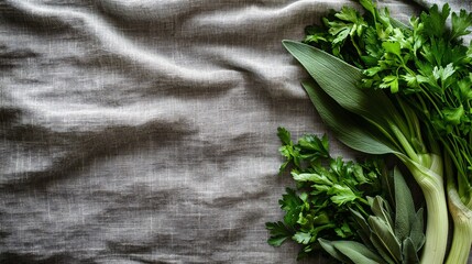 Poster - Fresh organic leeks arranged with sprigs of parsley and sage on a natural linen cloth background with side empty space for text Stockphoto style