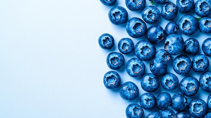 Poster - Isolated on white background a casual scattering of fresh blueberries in varying sizes spread naturally with side empty space for text Stockphoto style