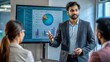 © N7 - An Indian male executive presenting a project on a digital screen during a meeting.