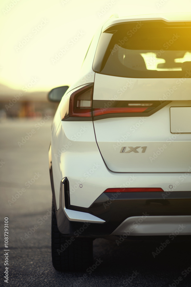 Rear partial view of the BMW IX1 eDrive electric SUV, showcasing its ...