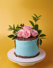 Wall Mural - Pastel blue cake with chocolate crumb, fresh pink roses and greenery. Tasty dessert. Sweet food.