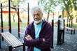 © Marko Geber - Portrait of a senior man exercising at outdoor fitness park in autumn