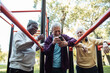© Marko Geber - Senior men socializing and relaxing at outdoor park fitness area