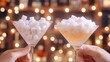 © mashimara - A clear martini glass filled with pink sugar cubes against a bright, colorful, blurred bar background.