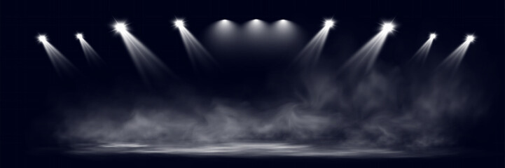 Aufkleber -  Spotlights shining down in a dark, misty atmosphere, creating a dramatic stage or stadium effect with beams of light piercing through the haze. Ideal for themes related to performances, events.