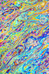 Wall Mural - Real photograph of a colorful light diffraction on a soap bubble surface with random swirls, curves and lines