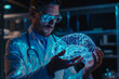 © Stas - A man Doctor or scientist is wearing glasses in a lab coat holding a glowing brain 3D model, concept study of the brain and the use of modern technologies