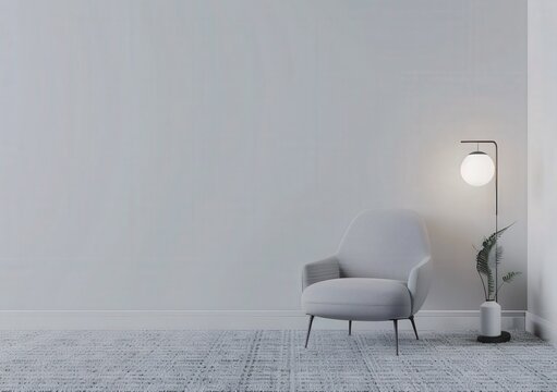 A minimalist living room with a comfortable armchair, a side table, a floor lamp, and a vase with dried branches against a white wall