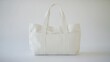© Pricha.RT - A beige tote bag standing upright against a plain white background, focusing on its versatile design.