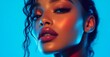 © fashion world - Portrait of a beautiful woman with makeup and glossy lips in neon light.