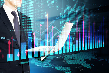 Wall Mural - Headless young businessman using laptop computer with growing forex chart hologram with map on blurry toned office background. Stock market, financial growth and trade concept. Double exposure.