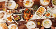 © peopleimages.com - Above, eating and festive with family and food for celebration, support and thanksgiving holiday. Catering, nutrition and reunion with meal and people at home for dinner, hosting and health together