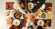 © peopleimages.com - Above, hands together and thanksgiving with family and food for celebration, support and festive holiday. Catering, gratitude and reunion with meal and people at home for dinner, hosting and health