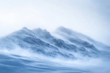 A snowy mountain landscape with a clear blue sky