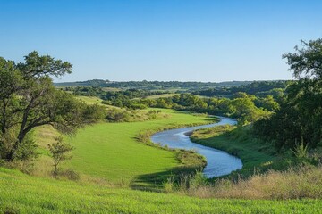 Poster - A serene landscape with a river flowing gently through a lush green field, perfect for use in environmental or travel projects
