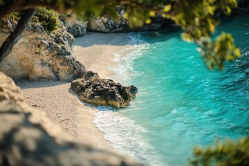 Aufkleber - A photograph of a rock submerged in the ocean on a sandy beach, suitable for use in travel or nature-themed projects