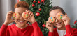 © Pixel-Shot - Funny little children with cookies at home on Christmas eve