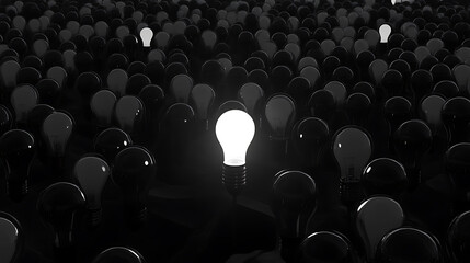 Aufkleber - A large number of light bulbs, all black with one glowing bulb in the center