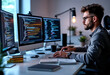 © Metehan - Focused Male Software Developer Coding on Laptop in Modern Office Environment