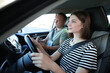 © New Africa - Driving school. Student passing driving test with examiner in car