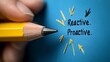 © Sam - A close-up of a hand holding a sharpened yellow pencil against a blue background with the words 'Reactive' and 'Proactive.'