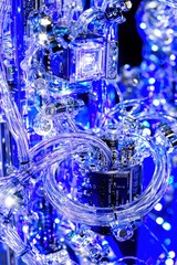 Poster - Intricate Close-Up of Blue LED Light Display with Transparent Tubing and Circuitry in a High-Tech Artistic Arrangement for Modern Aesthetic