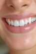 © Derek Brumby - Close-Up of a Smiling Woman's Mouth Showcasing Bright White Teeth