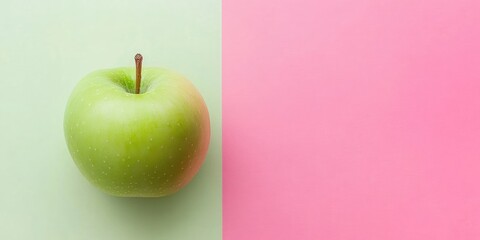 Poster - Green apple on a background featuring two shades of pink duotone. Area for text. Minimalist healthy food diet idea.