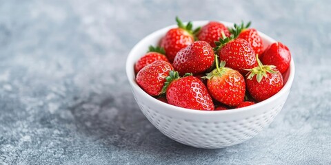 Poster - Close-up, vibrant and delicious fresh strawberries in a white bowl, ready for consumption. Selective focus, copy space.