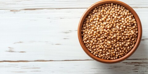 Aufkleber - Brown bowl of delicious buckwheat porridge on a white wooden table. Top view with copyspace.