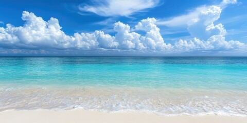 Poster - White sandy beach, clear blue ocean, visible horizon, beautiful sky with clouds.