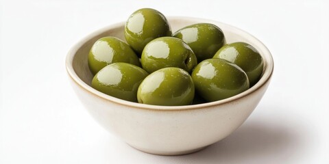 Canvas Print - Green olives in a bowl set against a white background.