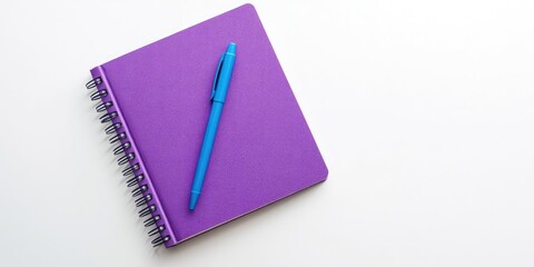 Poster - Top view of a purple notebook and blue pen on a white background. Suitable for school or office wallpaper. Flat lay, copyspace.