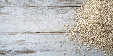 Poster - White quinoa on a white wooden surface. Top view. Free copyspace.