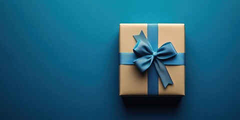 Poster - Flat lay gift box adorned with a bow on a trendy classic blue background, copy space.