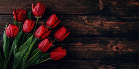 Aufkleber - A cluster of red tulips arranged on a dark wooden surface. Mockup, space for text.