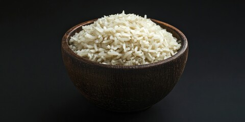 Poster - Jasmine rice in a brown bowl on a black background.