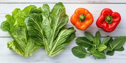 Poster - sorrel, tarragon, turnip cabbage leaves paired with sweet bell pepper on a white wooden background