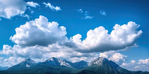 Poster - Dramatic landscape - white clouds above the mountain peaks in a blue sky on a sunny day with a copyspace available.