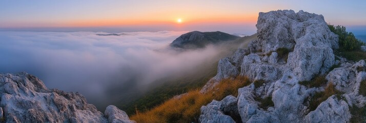 Aufkleber - A beautiful sunrise is seen over misty mountains, with rocky cliffs basking in the first light of day and fog below. Generative AI