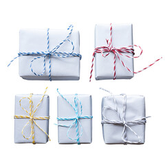 Wall Mural - set of five small, minimalist white gift boxes tied with colorful twine strings in red, blue, yellow