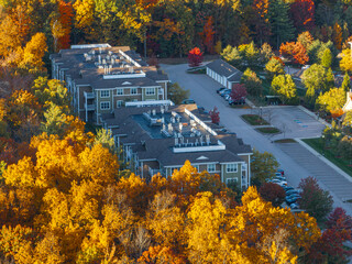 Wall Mural - aerial view of residential apartment community in autumn season